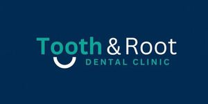 Dentist examining a patient at Tooth & Root Dental Clinic